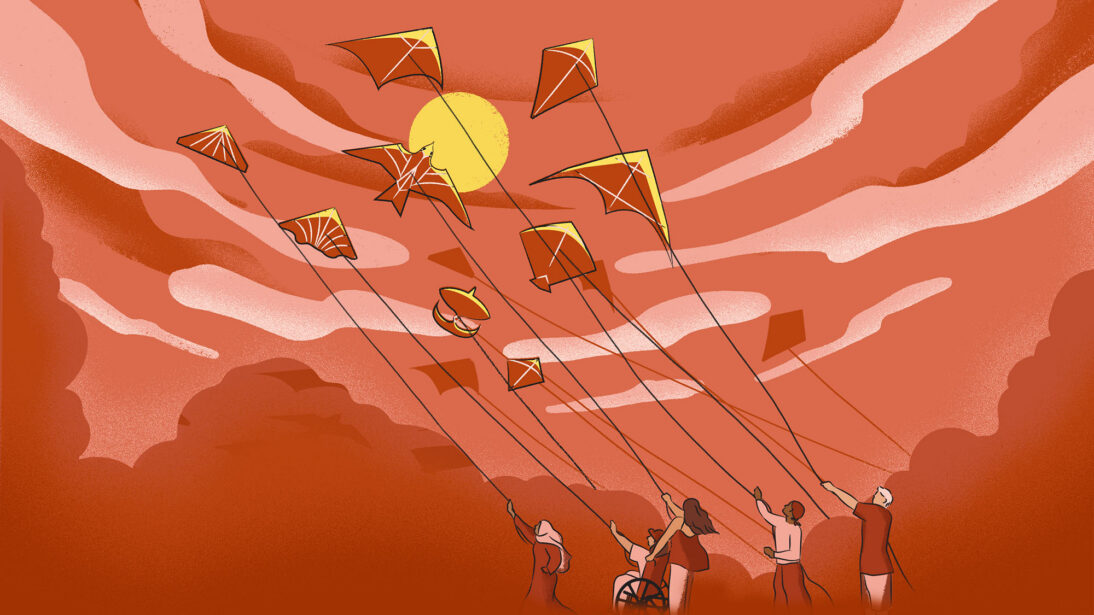 The image shows a group of people flying kites. The background is red and orange and there is a yellow sun
